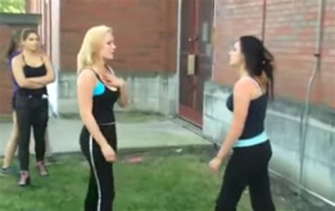 The clip shows the young woman dressed in a sailor-style suit as she is attacked by a group of women. . Girls strip fighting